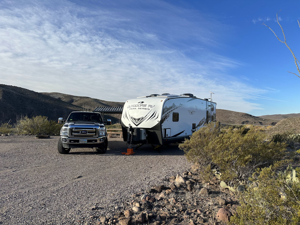 Ford F-350 towing Outdoors RV Mountain Trail 29TRX toy hauler travel trailer